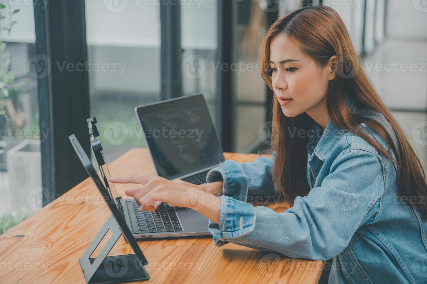 Female programmers are thinking and planning to work on programming, software coding and web design.Concept technology development. photo