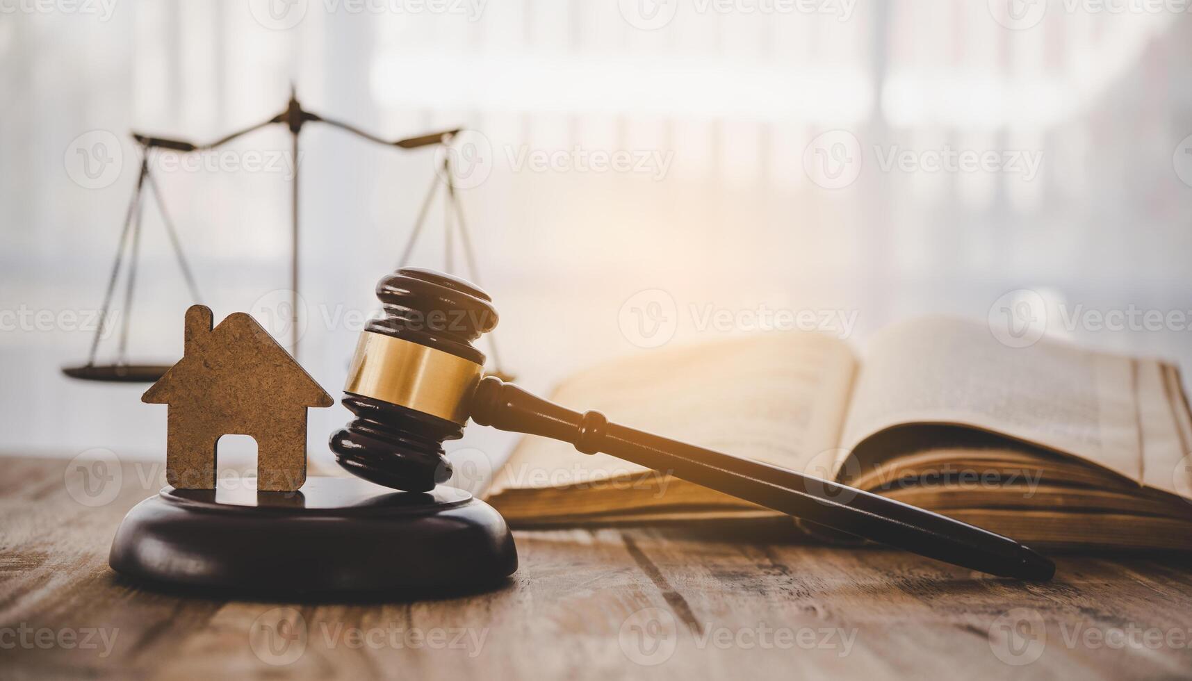 Model of house and gavel.House auction real estate law concept. photo
