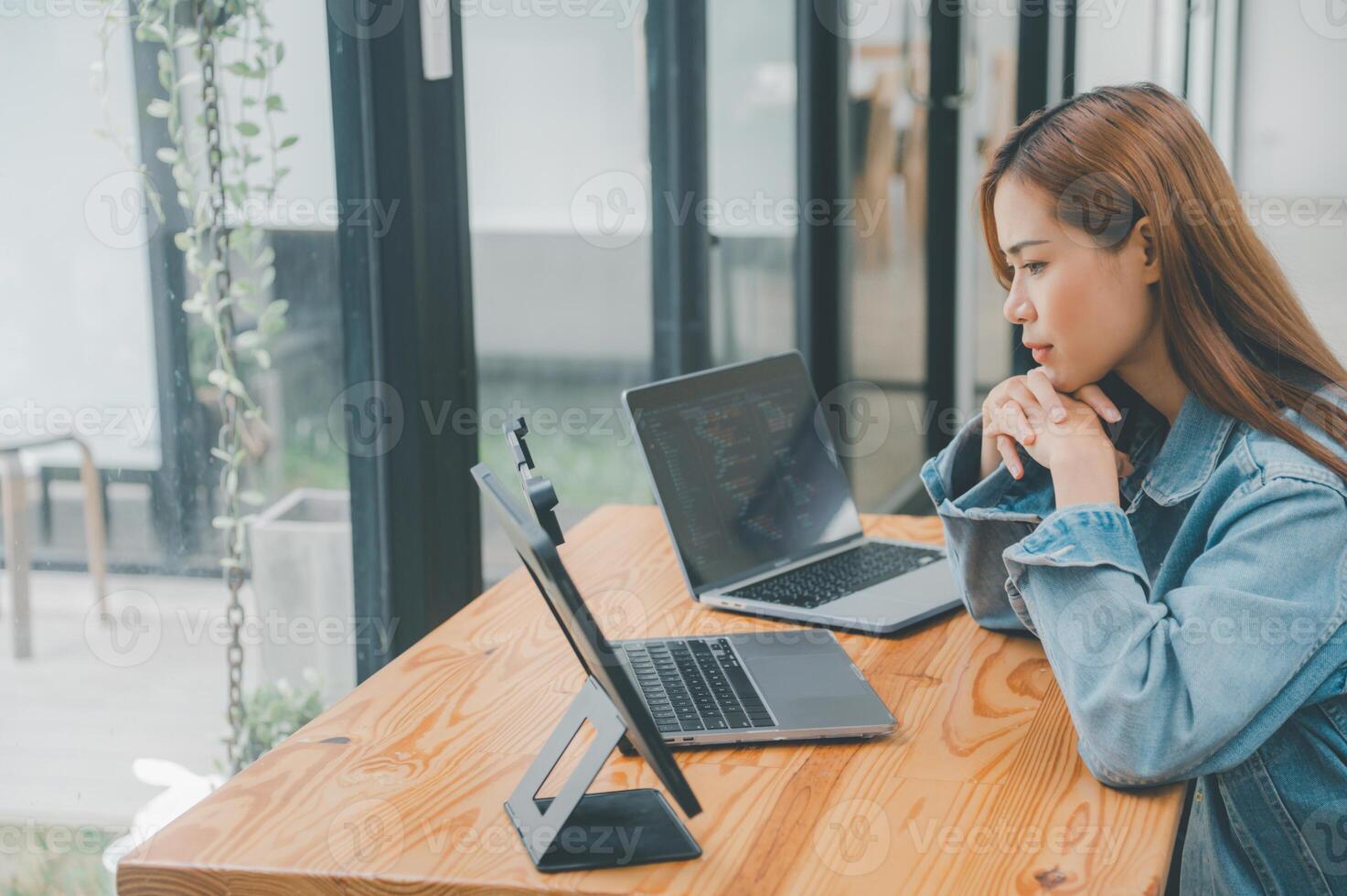 Female programmers are thinking and planning to work on programming, software coding and web design.Concept technology development. photo