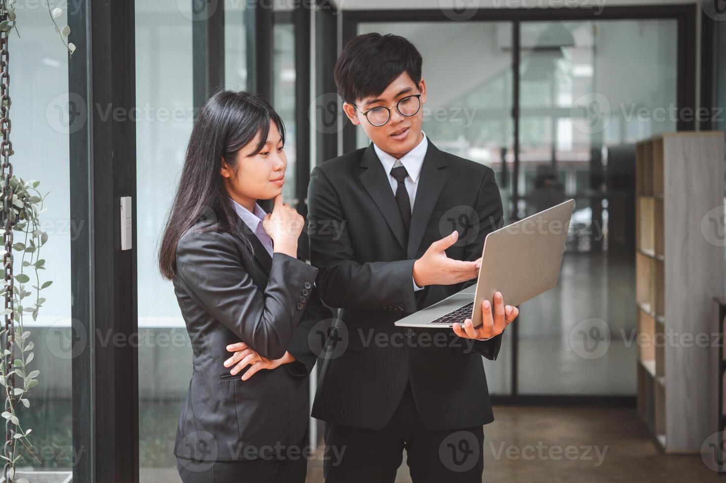 group of business people working and communicating together in the office With the charging of graphs for analysis, conceptual analysis and business planning photo