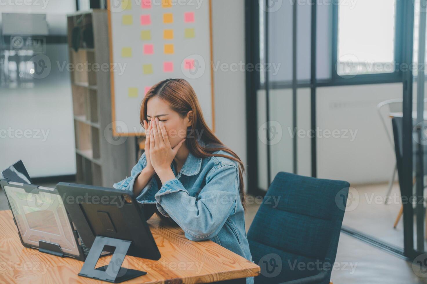Female programmers are sleepy and exhausted after working and planning to work on programming, software coding and web design. Concept technology development. photo