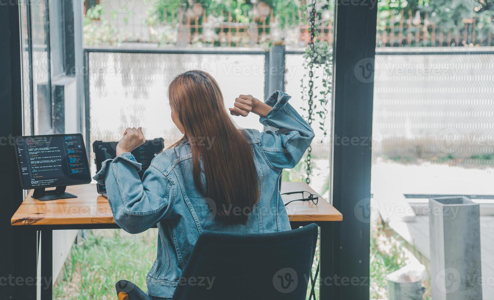 Female programmers are stretching oneself and relaxing after working and planning to work on programming, software coding and web design. Concept technology development. photo