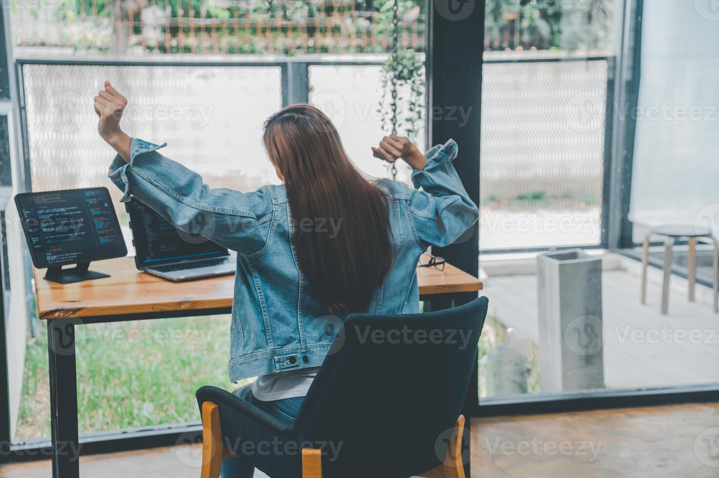 Female programmers are stretching oneself and relaxing after working and planning to work on programming, software coding and web design. Concept technology development. photo