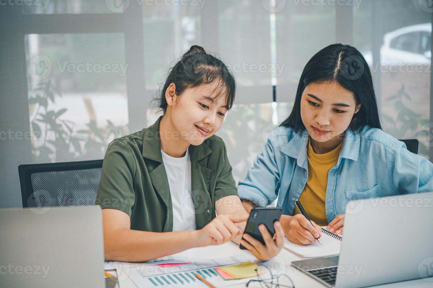 group of business people working and communicating together in the office With the charging of graphs for analysis, conceptual analysis and business planning photo