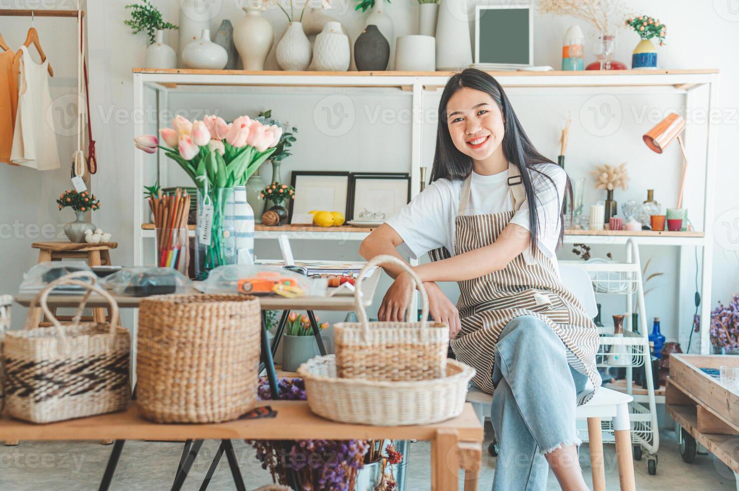 Small business owners pose smiling in their small shop to welcome customers and get customers online. And check the orders that customers have ordered of online retailers - online shopping. photo