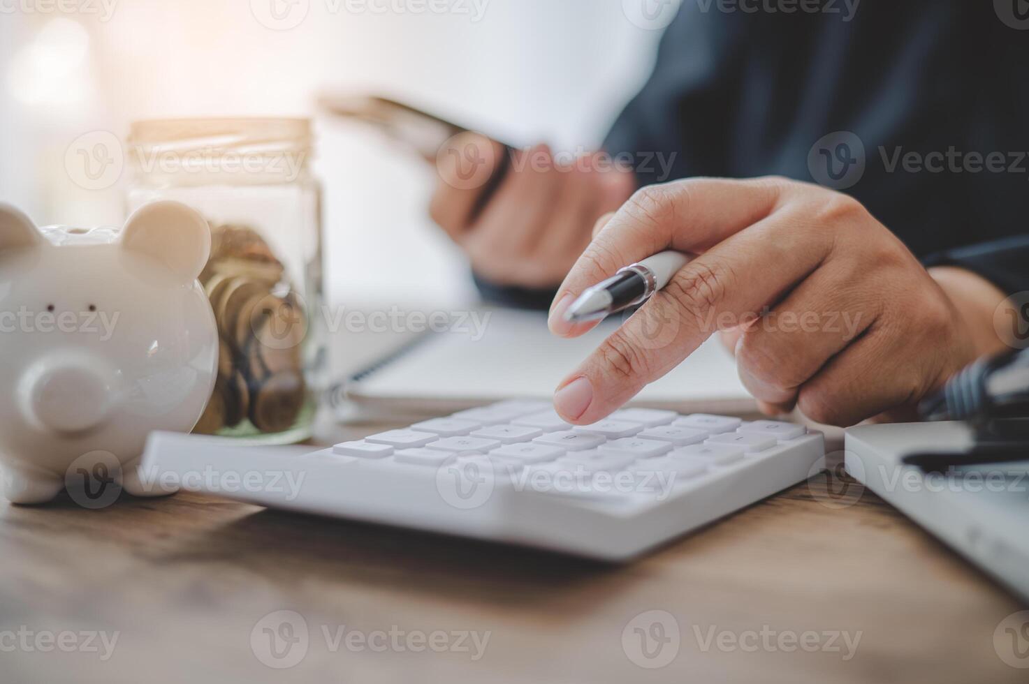 close up The business person is sitting on a calculator with a graph in the office of finance accounting concept photo