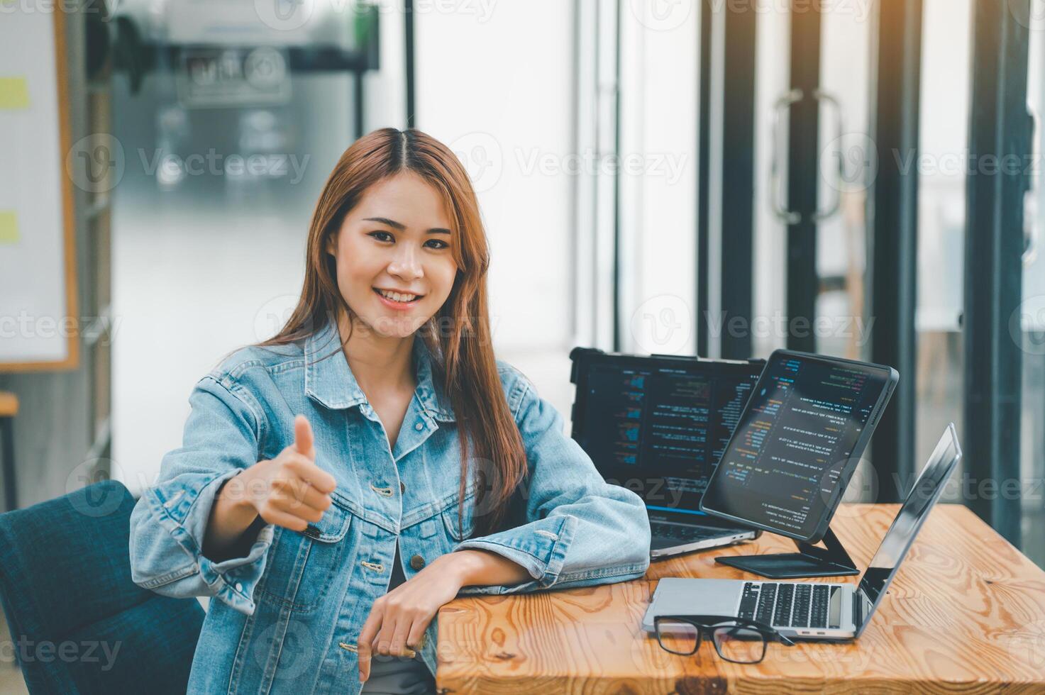 Female programmers are happily working on software coding and web designing.Concept technology development. photo