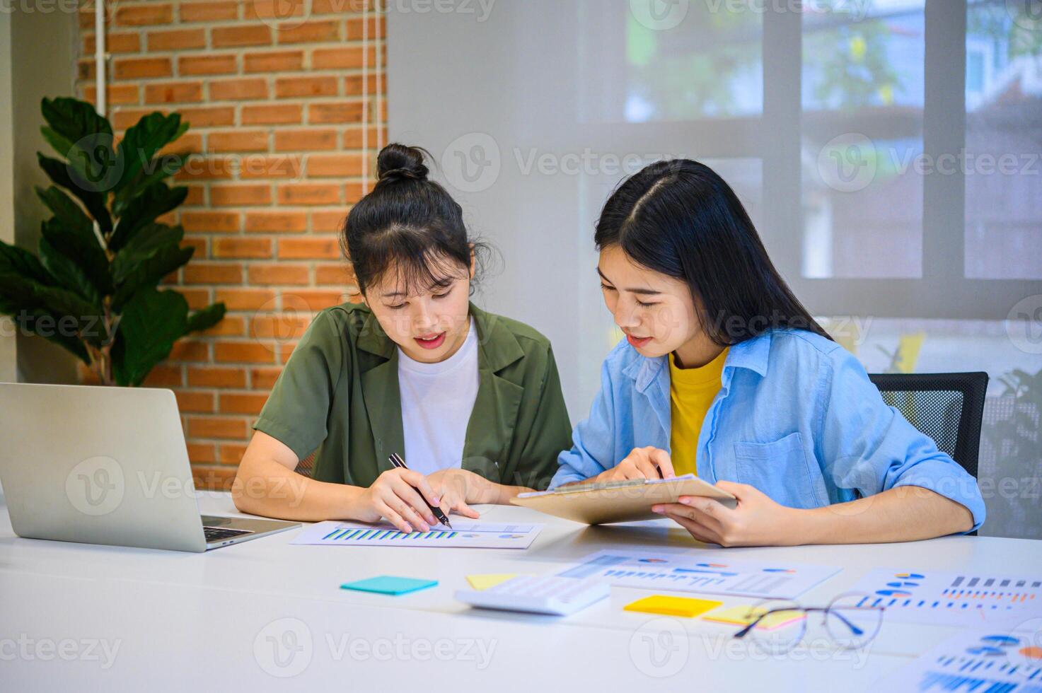 group of business people working and communicating together in the office With the charging of graphs for analysis, conceptual analysis and business planning photo