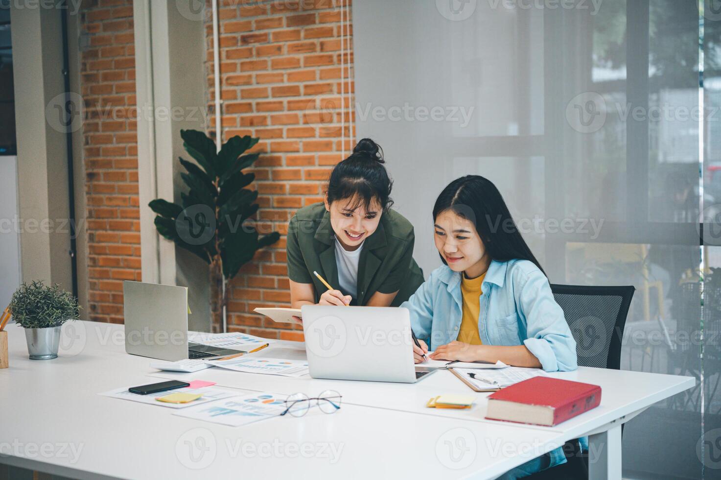 group of business people working and communicating together in the office With the charging of graphs for analysis, conceptual analysis and business planning photo