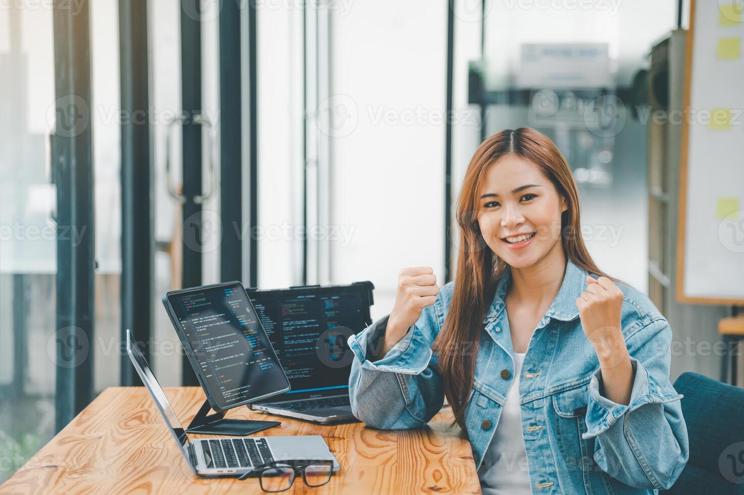 Female programmers are happily working on software coding and web designing.Concept technology development. photo