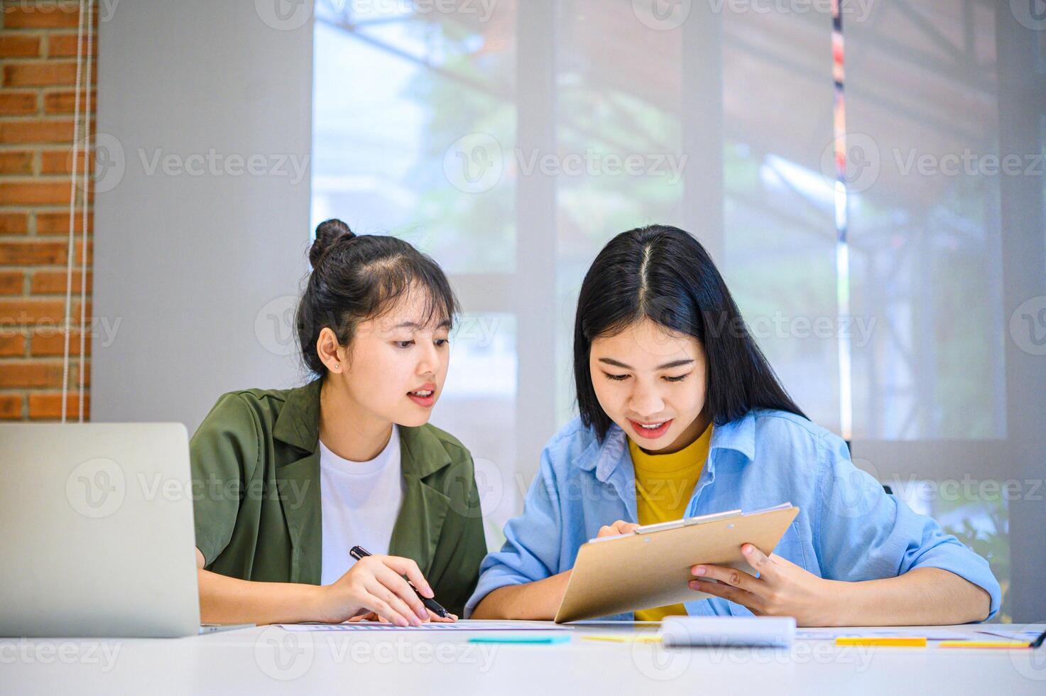 group of business people working and communicating together in the office With the charging of graphs for analysis, conceptual analysis and business planning photo