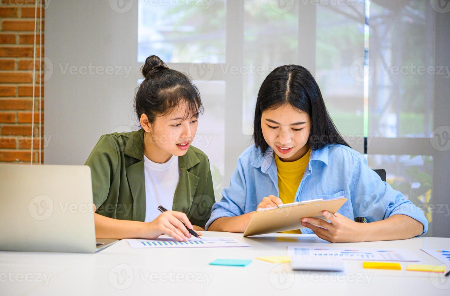 group of business people working and communicating together in the office With the charging of graphs for analysis, conceptual analysis and business planning photo