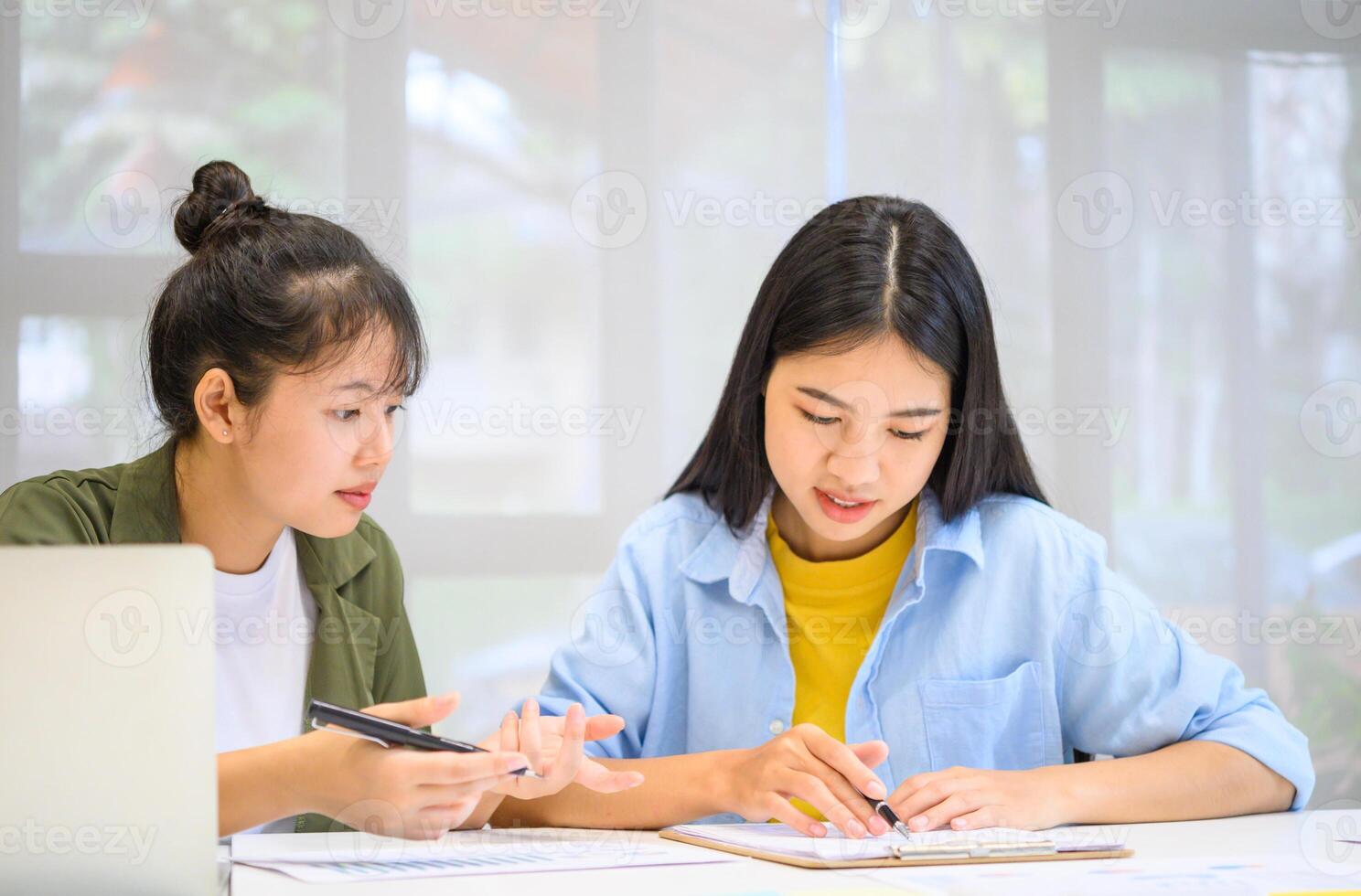 group of business people working and communicating together in the office With the charging of graphs for analysis, conceptual analysis and business planning photo