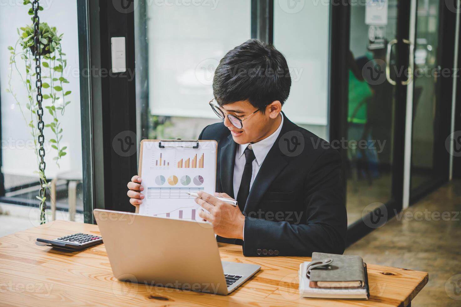 Businessman working online via call in team meeting with the charging of graphs for analysis, conceptual analysis and business planning photo