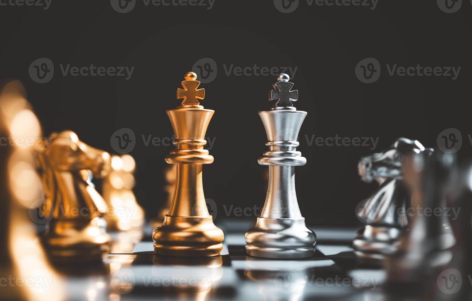 King golden chess and King silver chess standing face to face of the chess both teams . concepts of leadership and business strategy management and leadership photo
