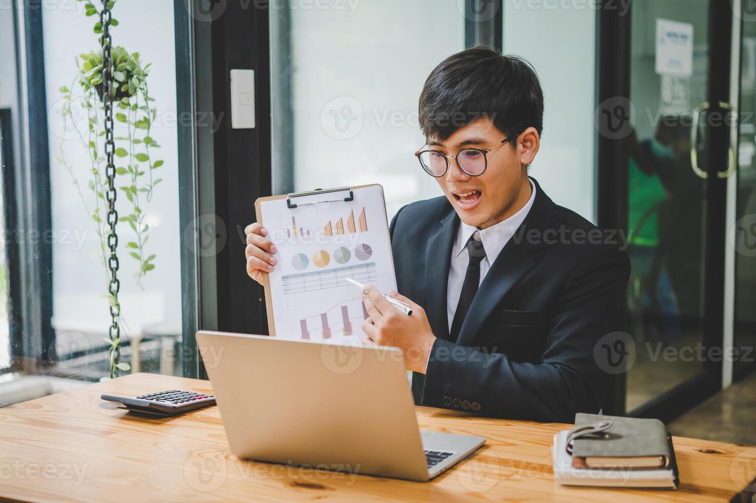 Businessman working online via call in team meeting with the charging of graphs for analysis, conceptual analysis and business planning photo