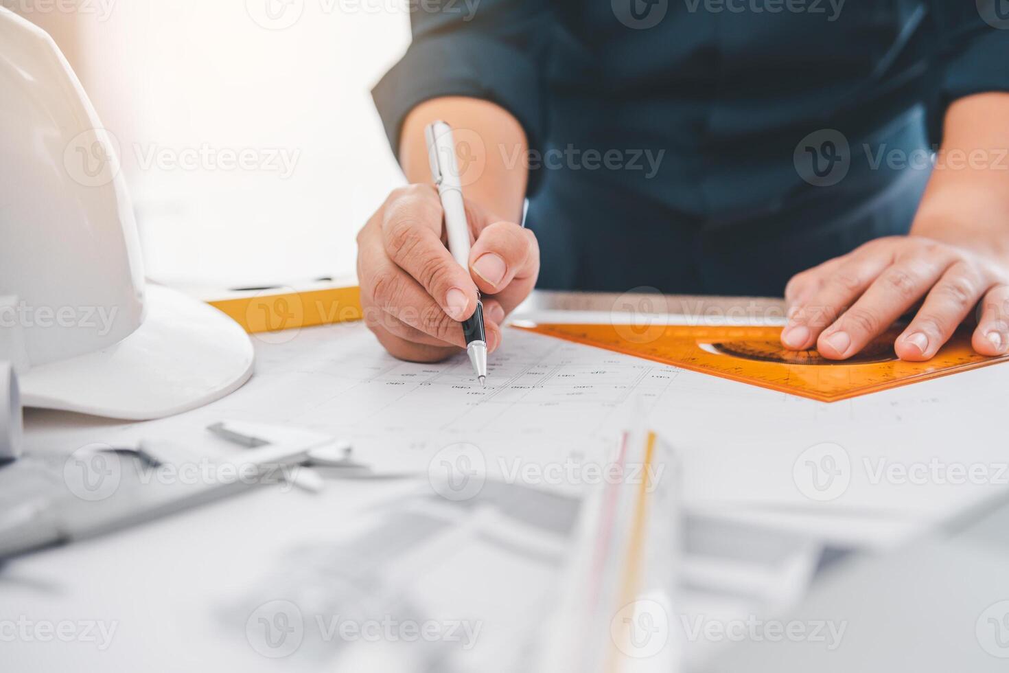 engineer working in office with blueprints, inspection in workplace for architectural plan, construction project ,Business construction photo