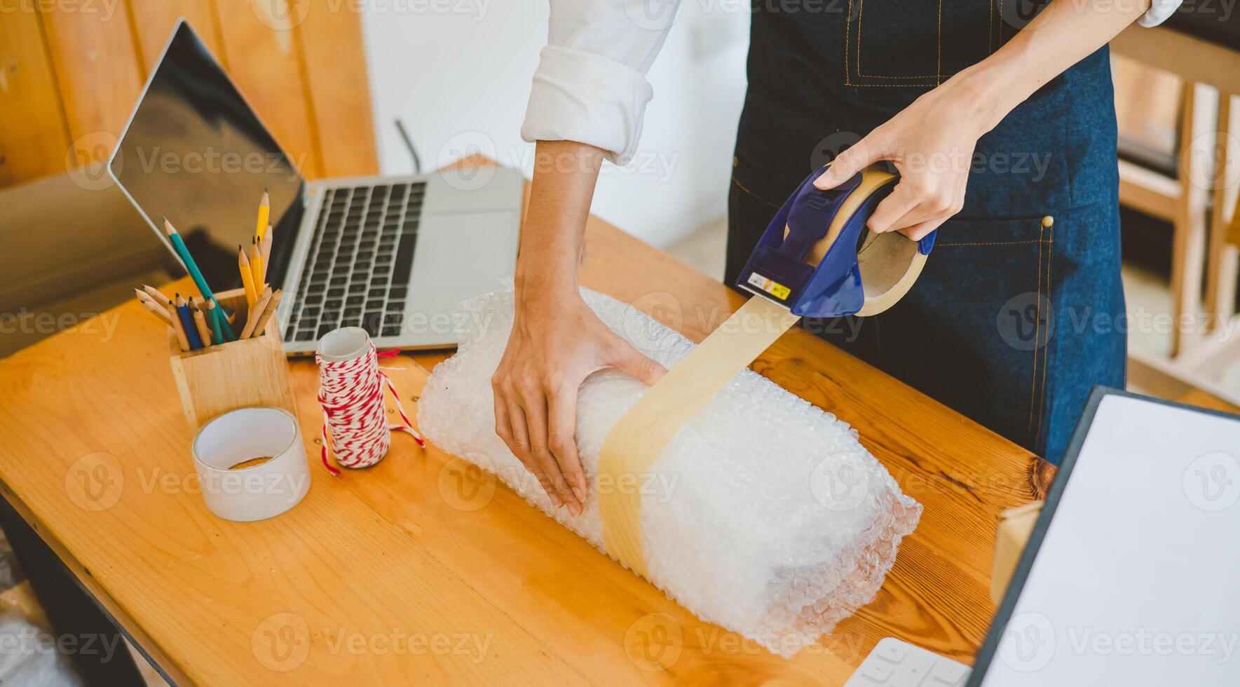 Online small business owners are packing their ordered products into the boxes for their customers based on the concept of online shopping - online shopping. photo
