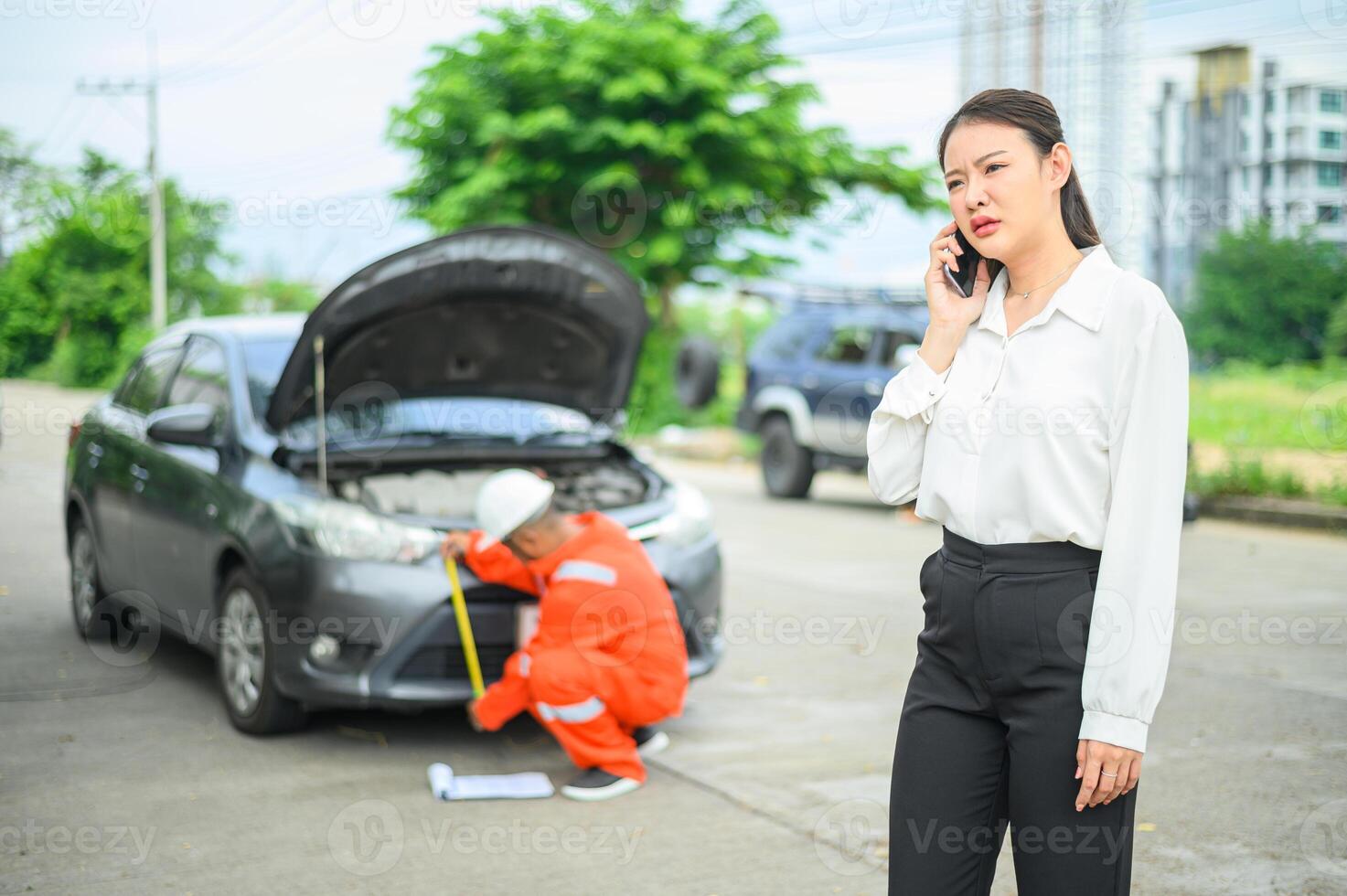 male insurance officer came to help inspect a customer's car that had an accident. Concept for vehicle crash, insurance claim. photo