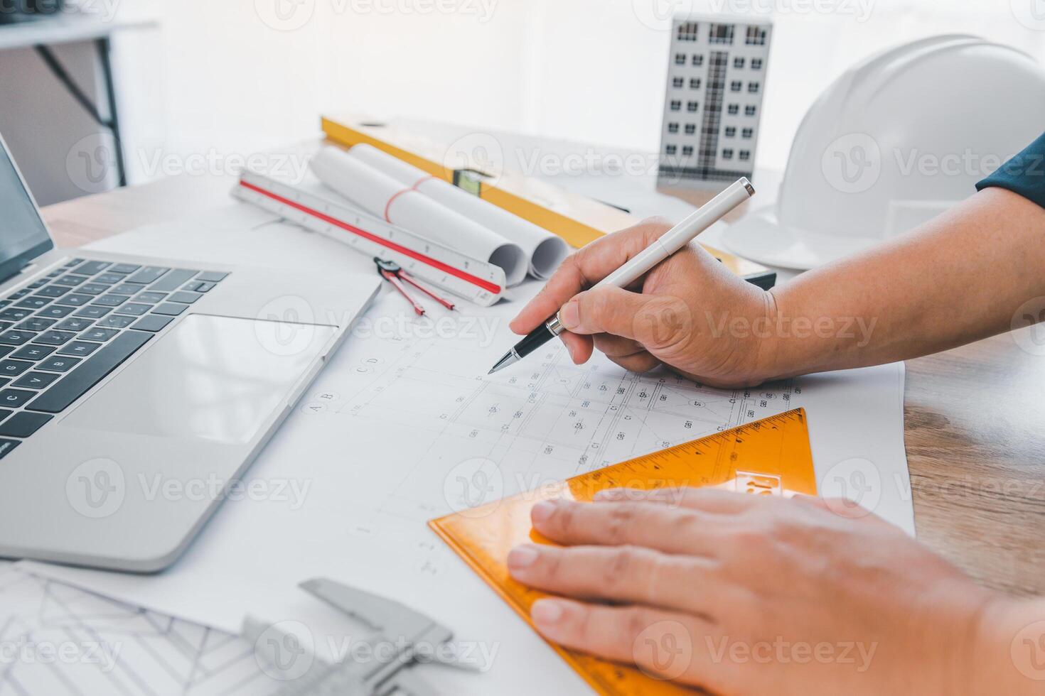 engineer working in office with blueprints, inspection in workplace for architectural plan, construction project ,Business construction photo