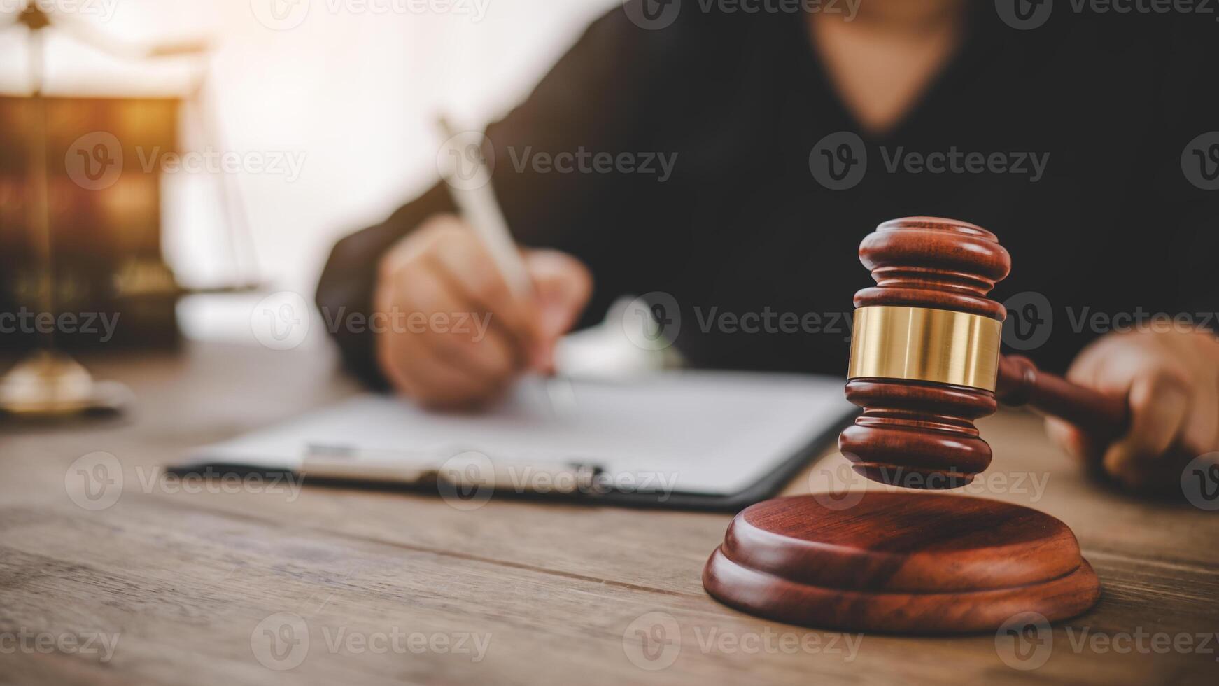 Law theme, mallet of the judge, law enforcement officers, evidence-based cases and documents taken into account. photo