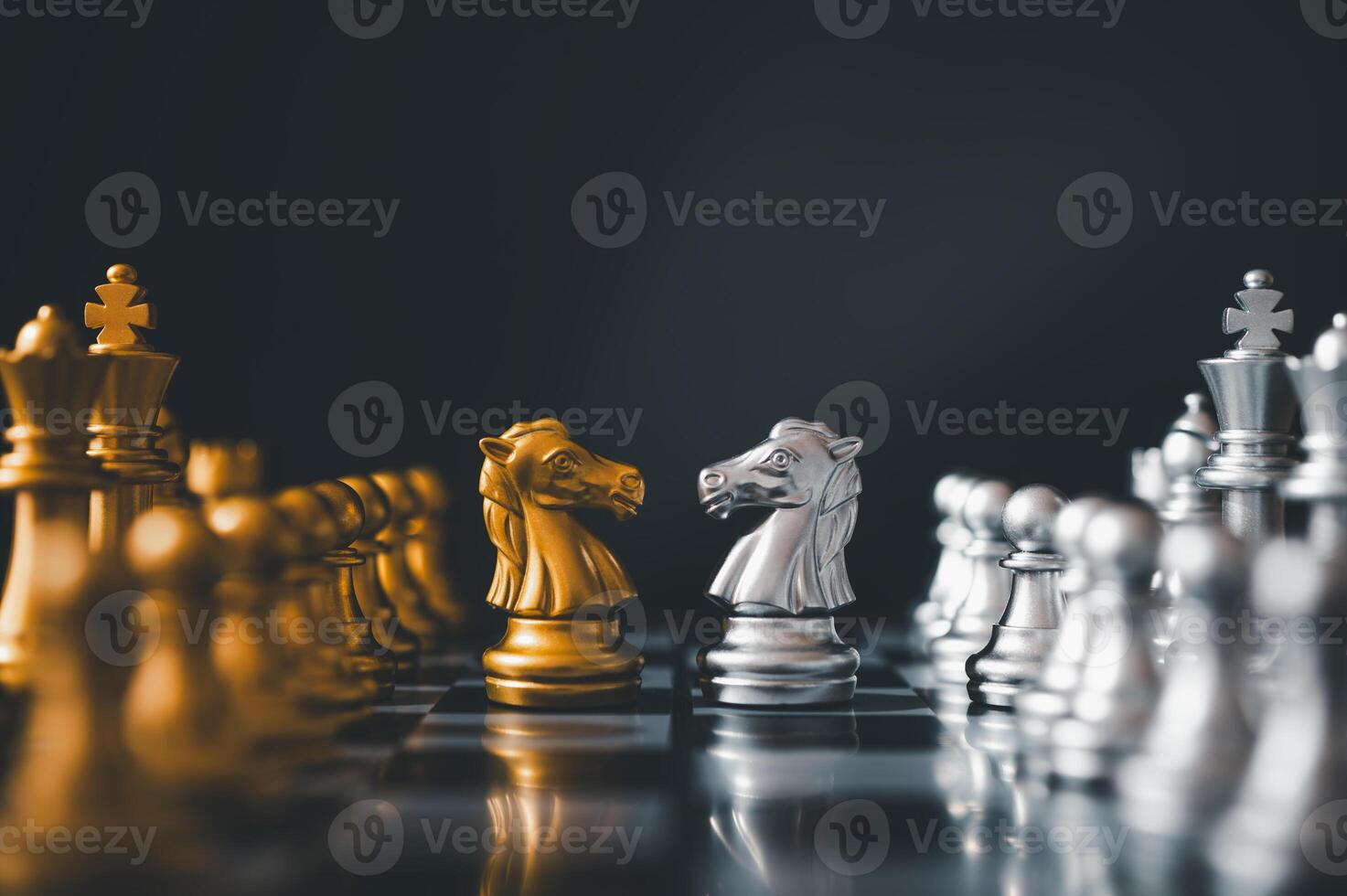 horse golden chess and horse silver chess standing face to face of the chess both teams . concepts of leadership and business strategy management and leadership photo