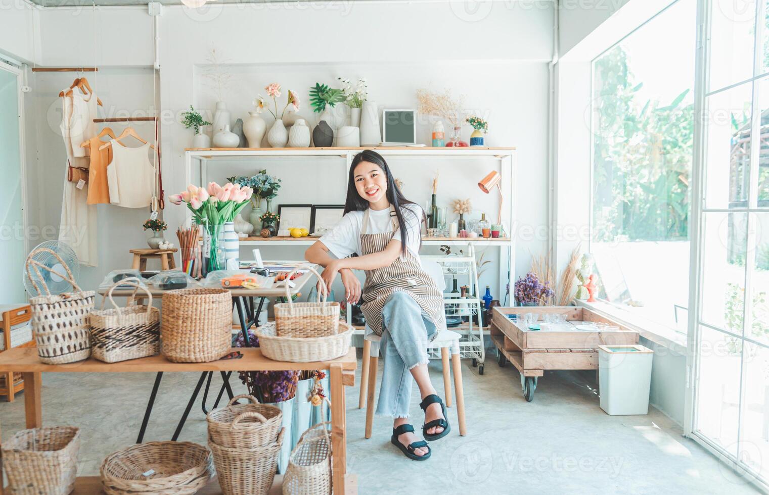 Small business owners pose smiling in their small shop to welcome customers and get customers online. And check the orders that customers have ordered of online retailers - online shopping. photo