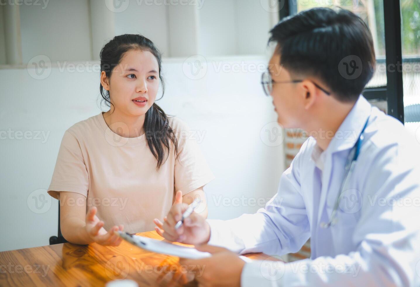 Doctors are inquiring about the patient's symptoms, notifying the results of the physical examination, and recommending treatment and health care. photo