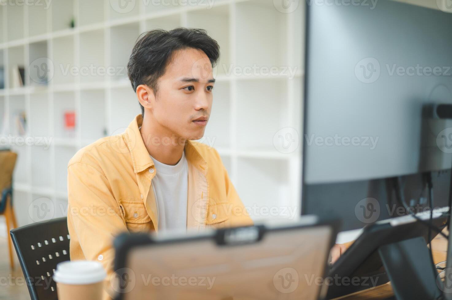 Young programmer working on coding, software development and web design in software company office.Concept technology development photo