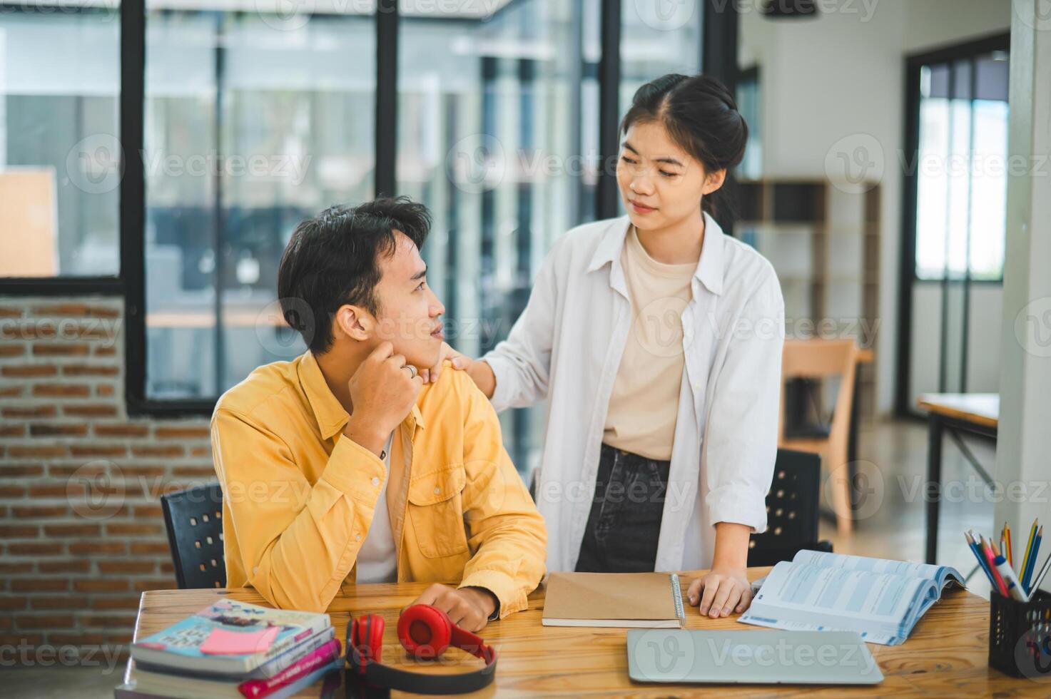 Fellow students are consoling friends who are disappointed in grades, frustrated with tasks that are not meeting their goals, helping each other. photo
