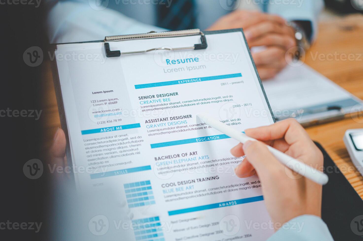 HR managers are interviewing job applicants who fill out their resume on the job application form in order to consider accepting a job as a company photo
