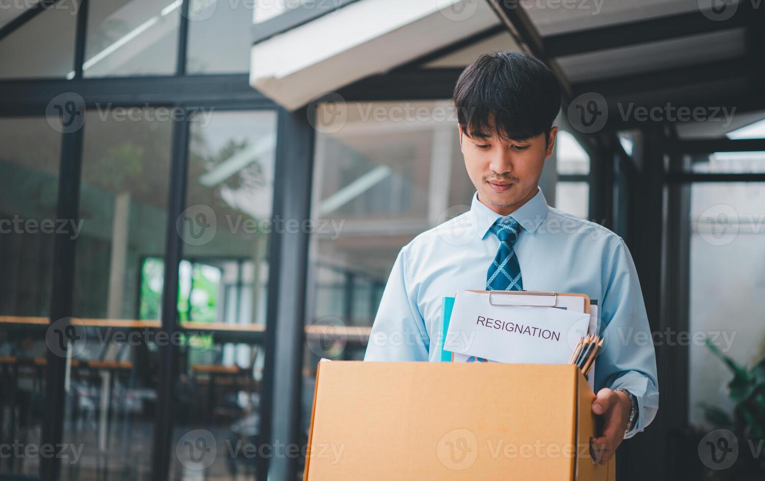 Young company employee stressed After resigning from work to find a new job , was fired by the company or when the employment contract expires, resulting in being unemployed photo
