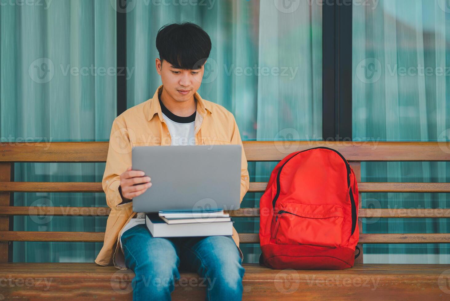 Students are doing research and finding knowledge on the internet on laptops in the university area. photo