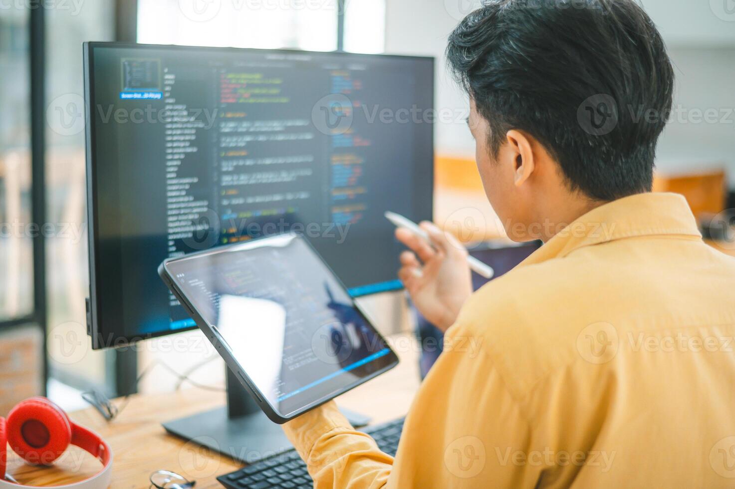 Young programmer working on coding, software development and web design in software company office.Concept technology development photo