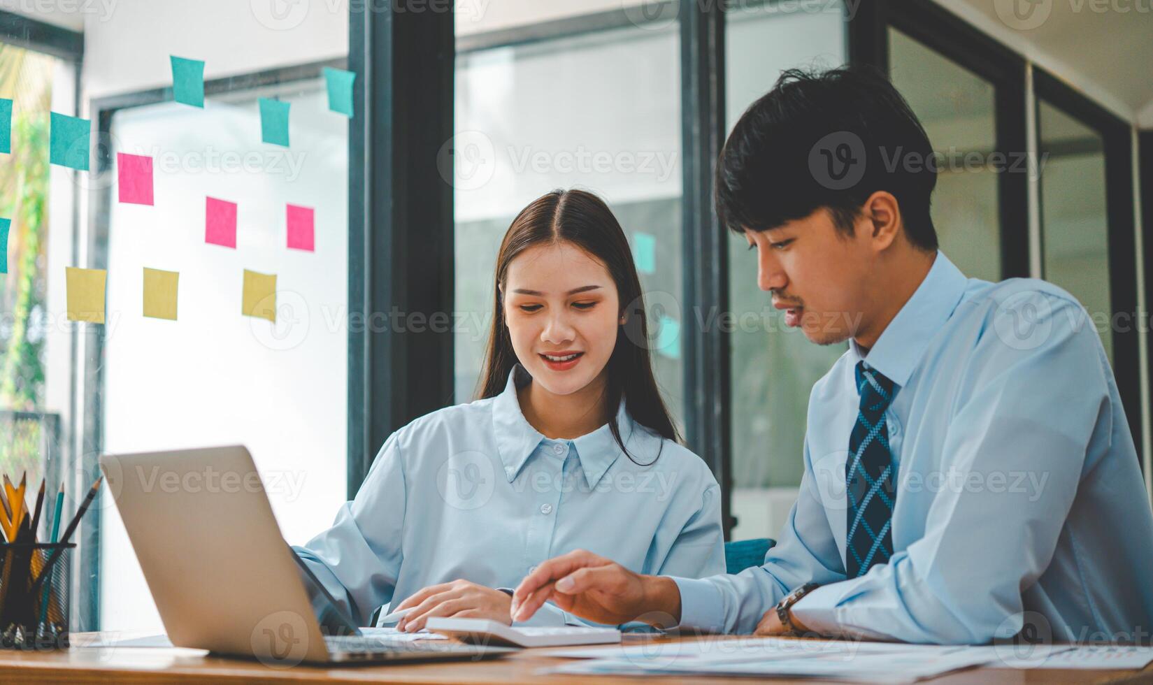 group of business people working and communicating together in the office With the charging of graphs for analysis, conceptual analysis and business planning photo