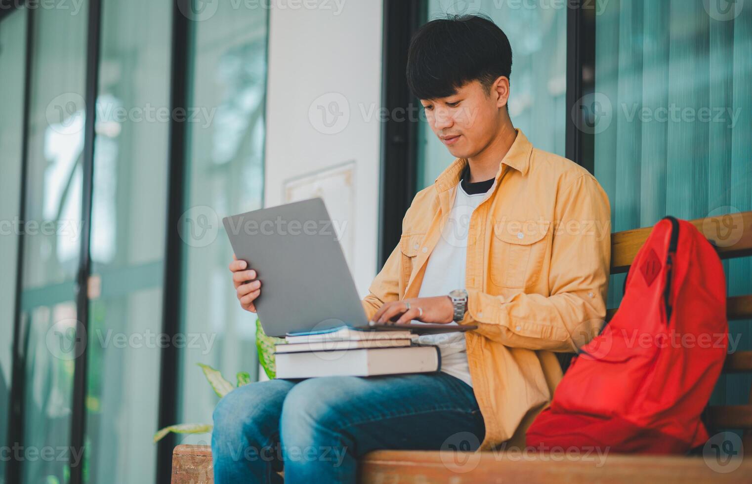 Students are doing research and finding knowledge on the internet on laptops in the university area. photo
