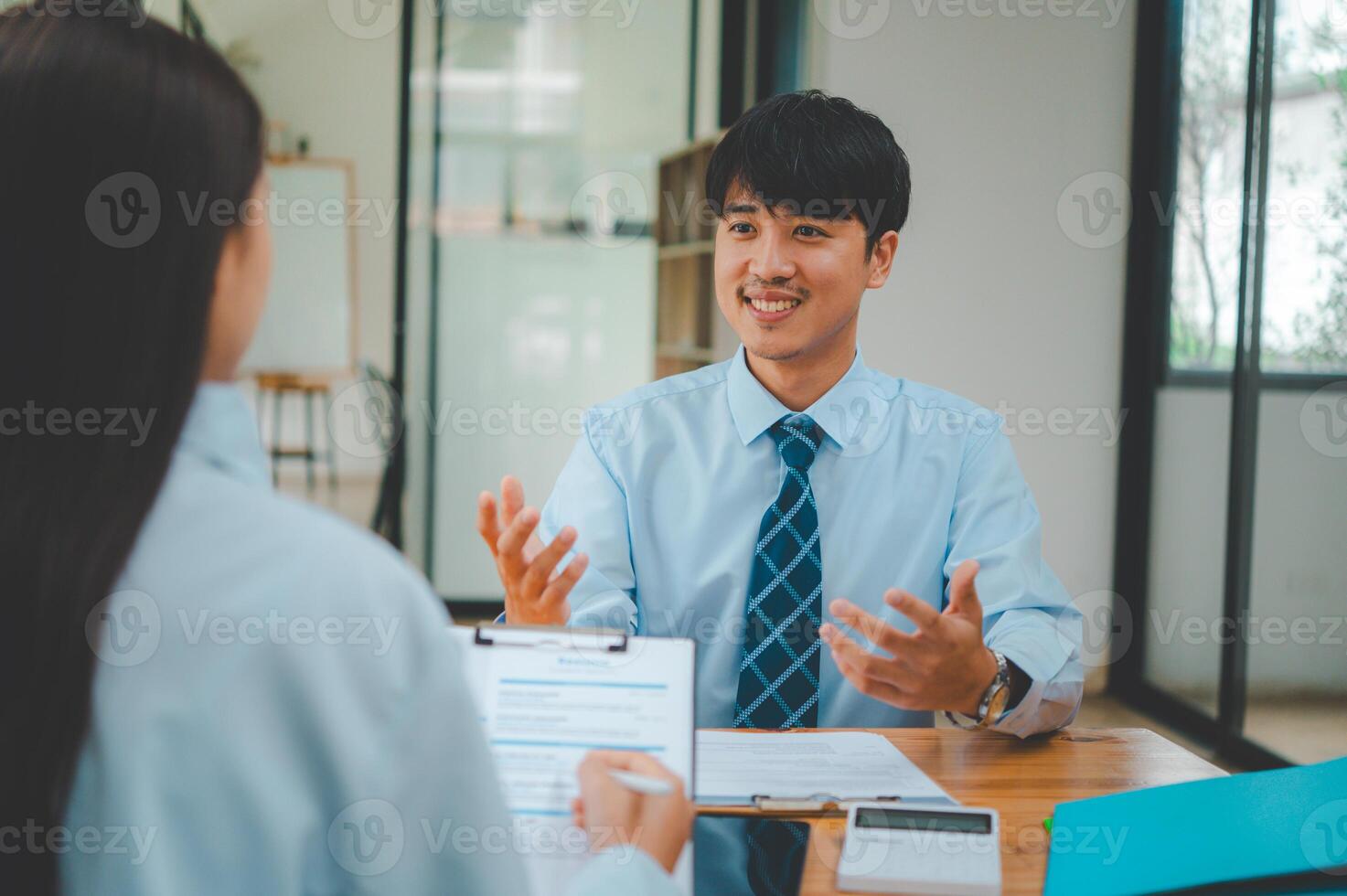 Job applicant introducing himself For a job interview after submitting a resume document to the Human Resources Manager for consideration for employment in the company. photo