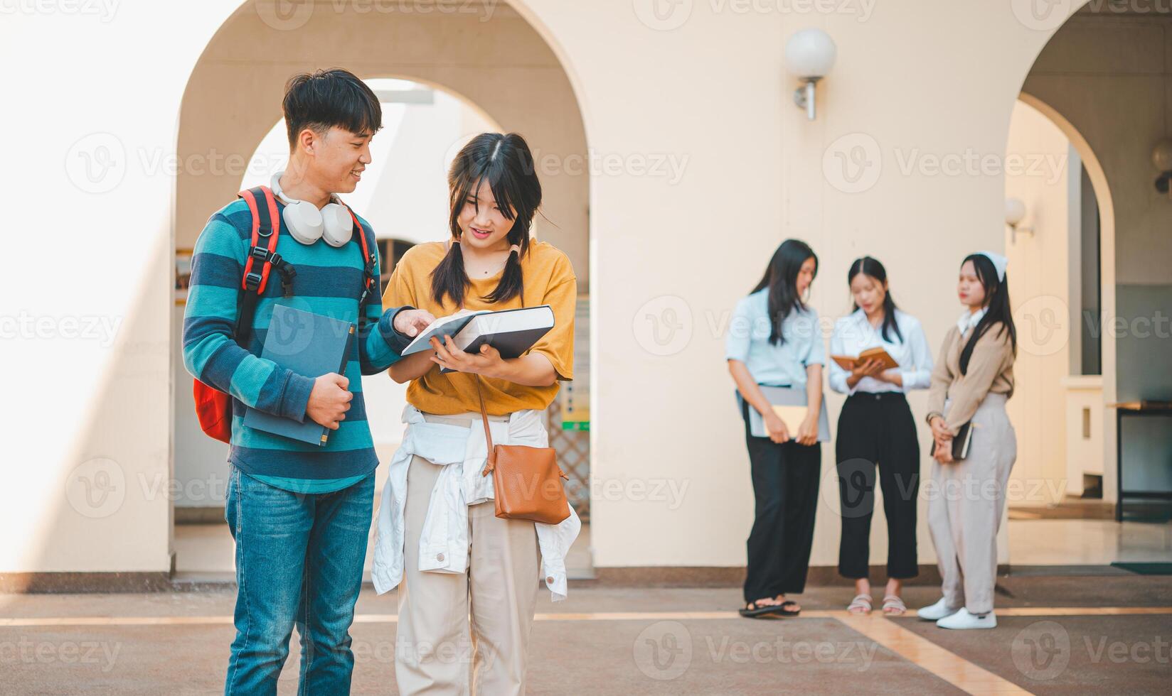 group of students young university students consulting doing homework, cooperating research plan Discuss concepts and strategies. Prepare presentations on laptops and tablet computers. photo