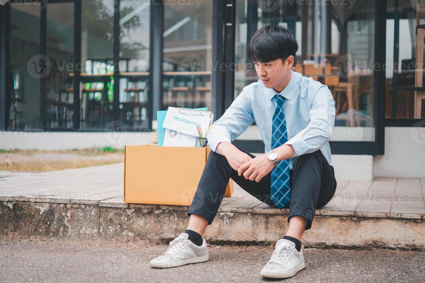 Young company employee stressed After resigning from work to find a new job , was fired by the company or when the employment contract expires, resulting in being unemployed photo
