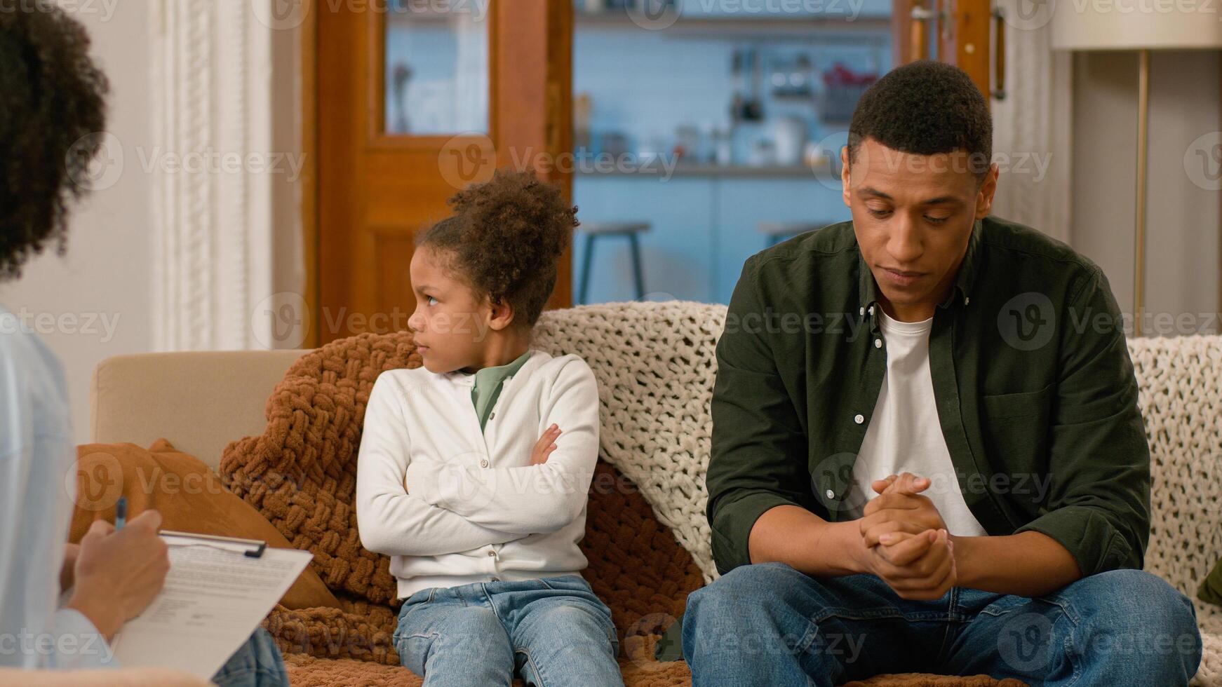 African American father daughter child psychologist visit professional specialist mental health problem man talking doctor little girl no refuse disagree shake head cross arms difficulties protest kid photo