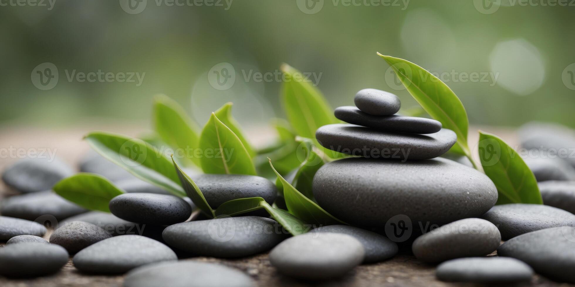 Serene spa composition with smooth stones and fresh green leaves. photo