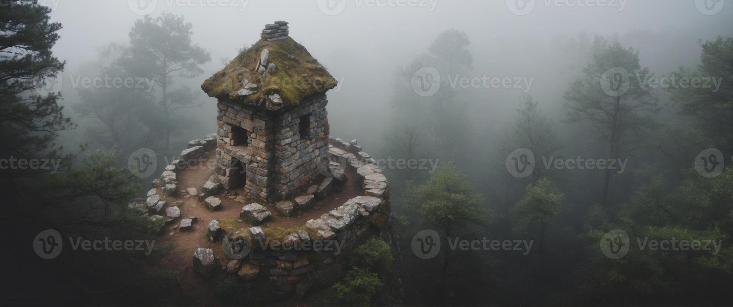 Aerial View of an Ancient Stone Structure in a Foggy Forest. photo