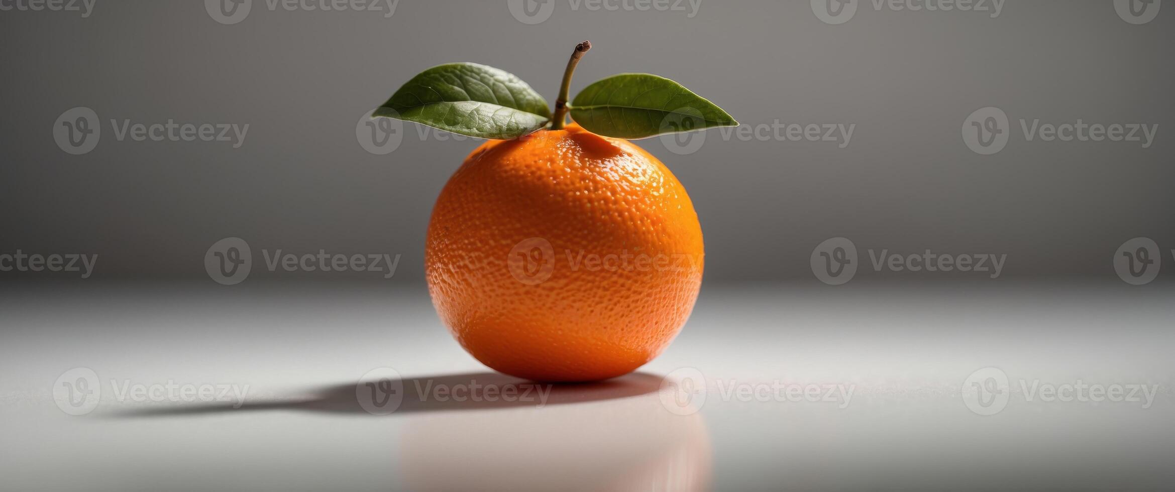 A Single Orange with a Shadow on a White Surface. photo