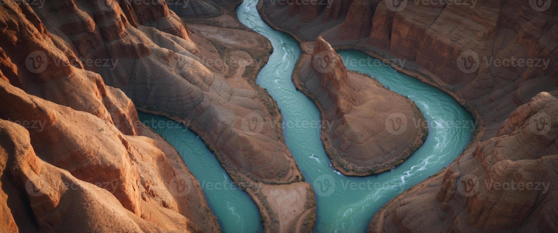 Aerial View of a River Winding Through a Canyon with Layered Rock Formations. photo