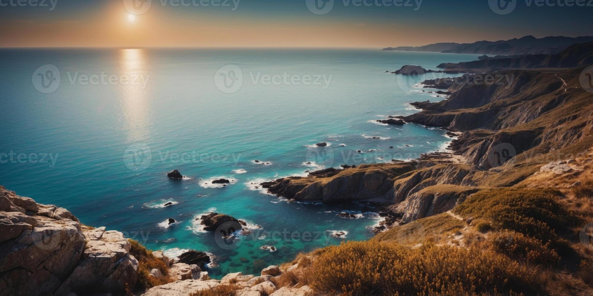 High altitude shot of a rugged coastline under a clear blue sky. photo