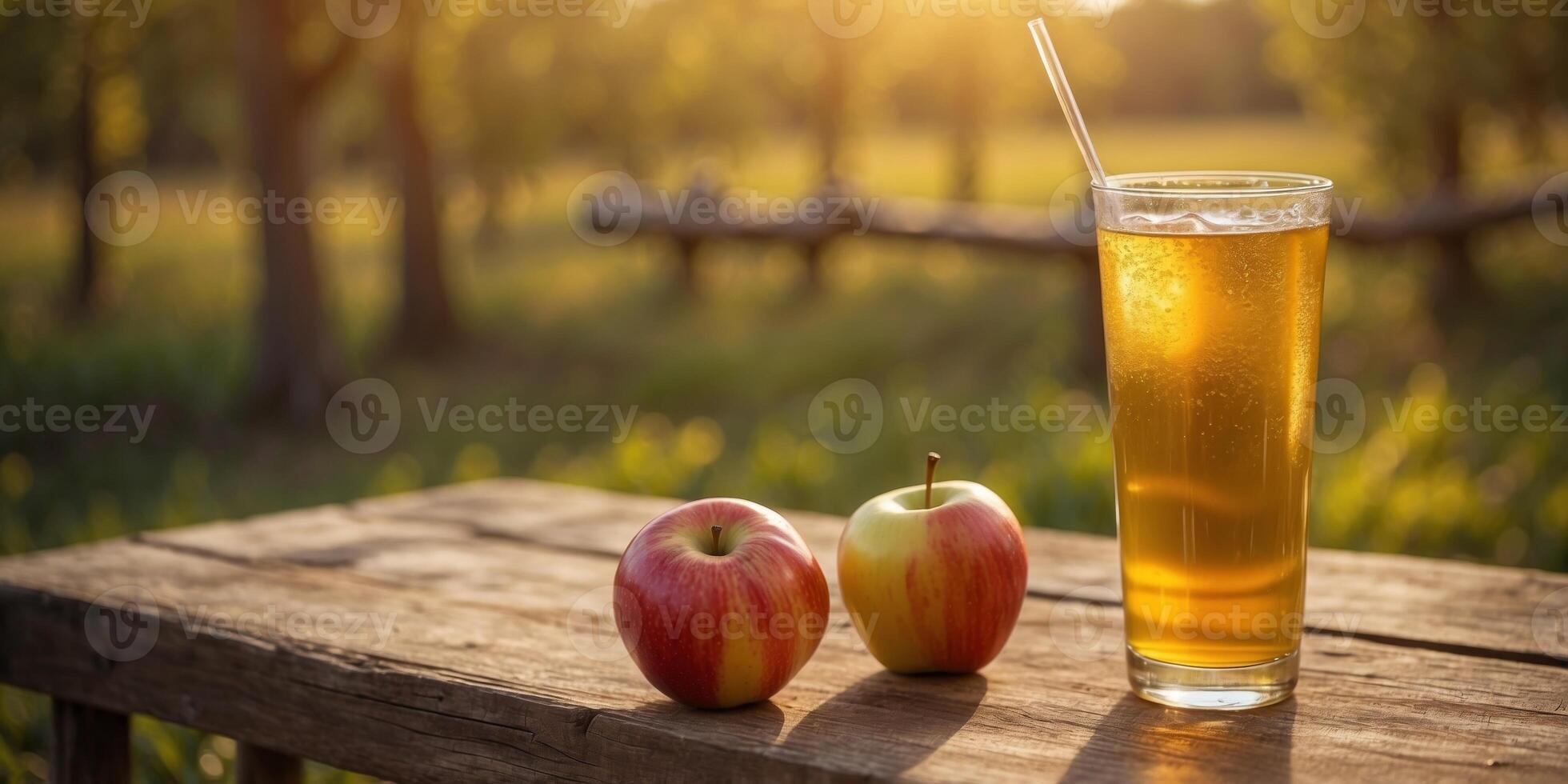 Golden hour orchard with a refreshing glass of apple juice and fresh apples on a rustic table. photo