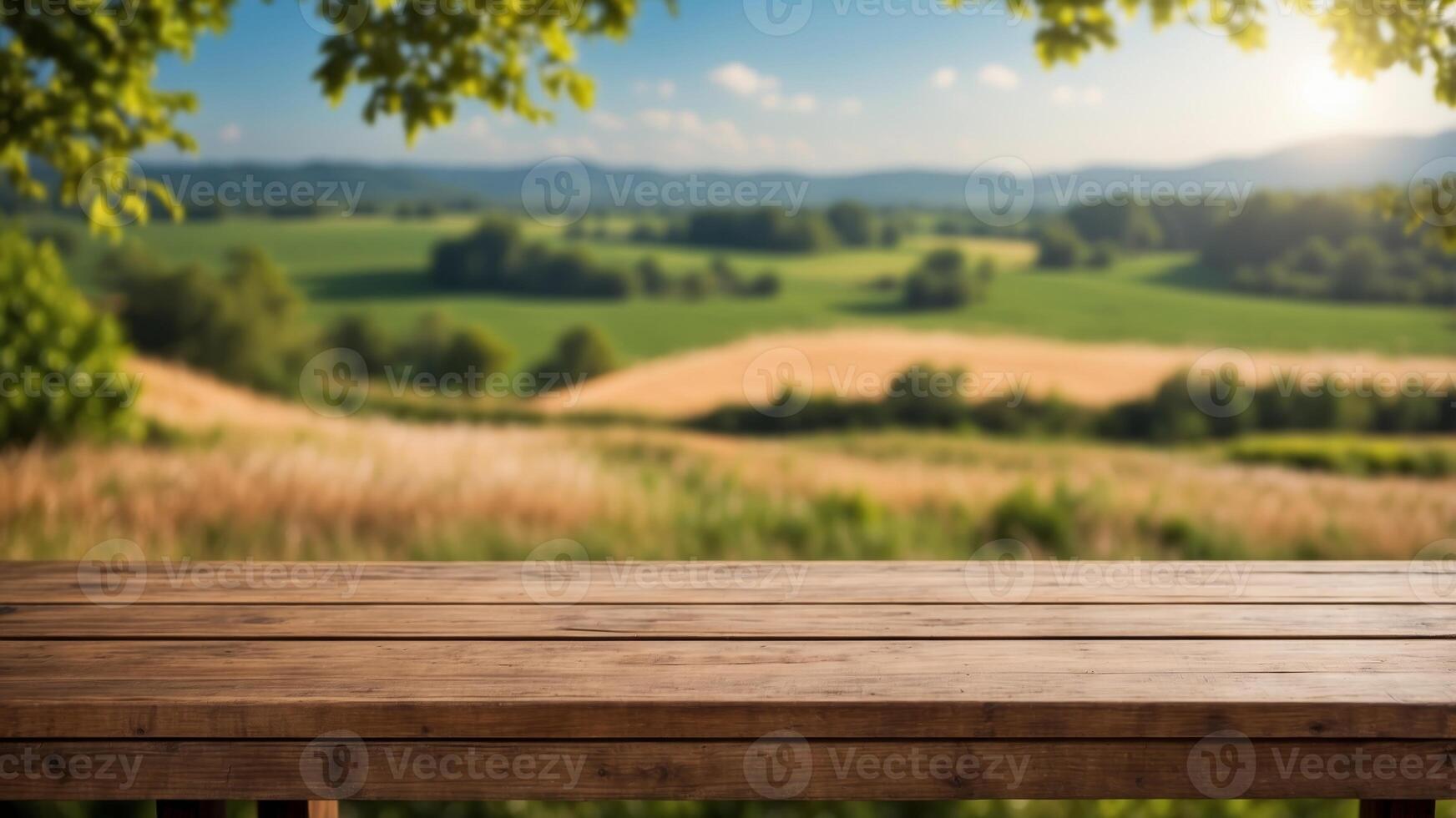 An empty wooden table top for product advertising with an idyllic view of the countryside with green nature. photo
