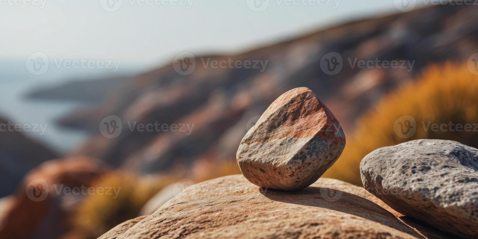 A tight shot of a rock with a hazy sky in the background. photo