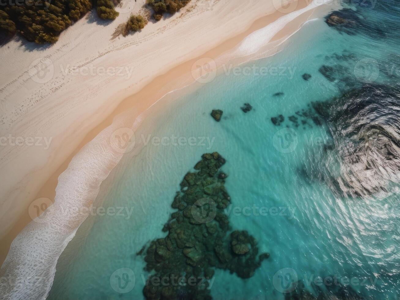 A Stunning Aerial View of a Turquoise Sea Meeting a Sandy Beach in a Remote Island. photo