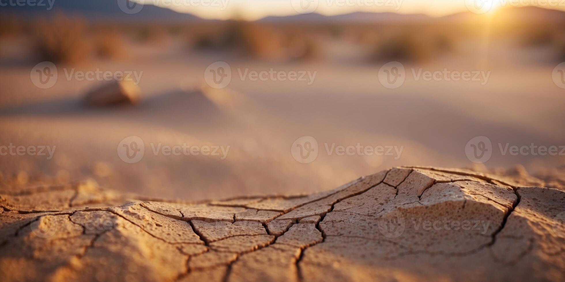 Desolate desert landscape with cracked earth and. photo